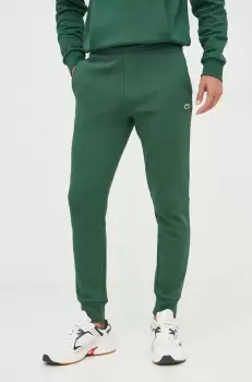Lacoste pantaloni de trening barbati, culoarea verde, neted imagine