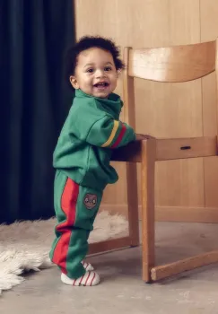 Mini Rodini pantaloni de trening din bumbac pentru copii E.T. culoarea verde, cu imprimeu, 25830100 imagine