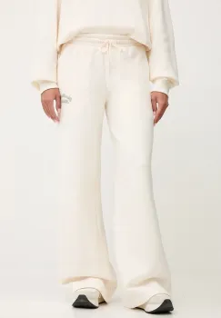 New Balance pantaloni de trening culoarea bej, cu imprimeu, WP53902PEF imagine