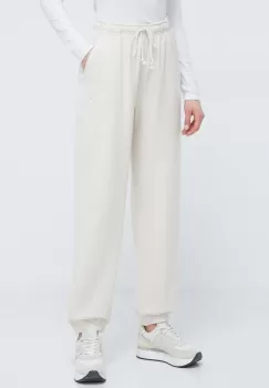 New Balance pantaloni de trening din bumbac culoarea bej, neted imagine