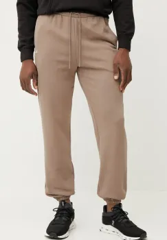 Puma pantaloni de trening din bumbac barbati, culoarea maro, neted, 631535 imagine