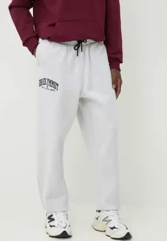 Tommy Jeans pantaloni de trening culoarea gri, melanj, DM0DM19802 imagine