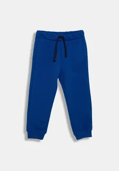 United Colors of Benetton pantaloni de trening din bumbac pentru copii cu imprimeu, 3J70GF010 imagine