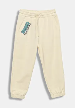United Colors of Benetton pantaloni de trening din bumbac pentru copii culoarea bej, cu imprimeu, 3J68GF04Z imagine
